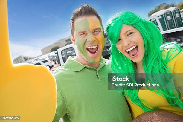 Crazy Fan Couple Cheering For Team Outside Stadium Stock Photo - Download Image Now - Fan - Enthusiast, University, Tailgate Party