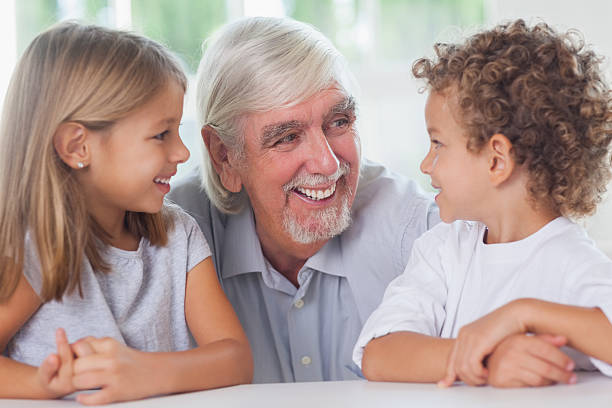 istock Happy children with grandfather 459965447