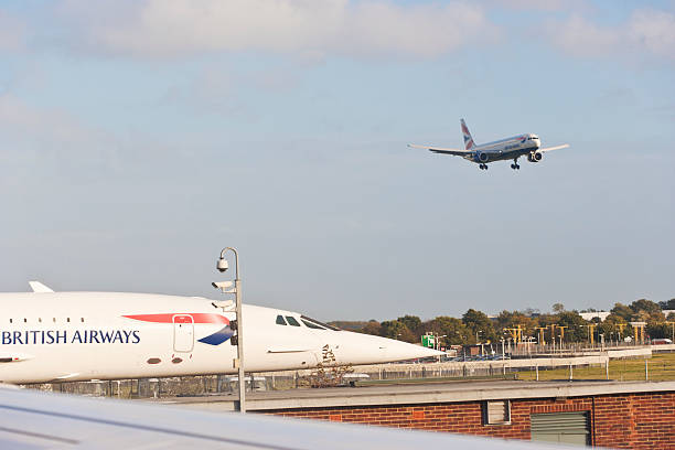 London, England - November 2, 2013: Close up of the famous Concorde-Airplane on London Heathrow airport. Another plane is preparing for landing on the airport. In this image you can see  Concorde No. 208 G-BOAB. The Concorde was an airplane that was able to fly with a maximum speed of 2500 km/h. After a crash in 2000 with 109 people, several cirumstances lead to the fact that the Concorde was retired in 2003.