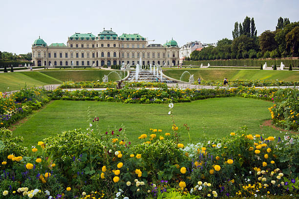 Upper Belvedere Palace and grounds in Vienna, Austria Vienna, Austria - August 9, 2013: People meander about the grounds and gardens of the Belvedere Palace complex with Upper Belvedere, completed in 1723, seen in the distance. belvedere gardens stock pictures, royalty-free photos & images