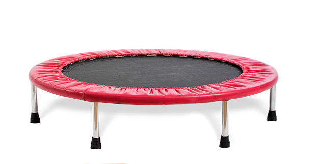 Black and red small trampoline isolated on white