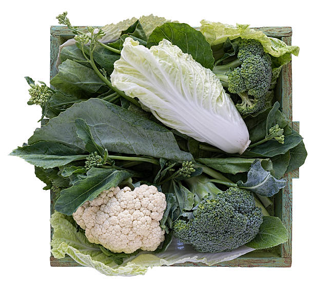 istock Green leafy vegetables in a wooden tray. 459971861