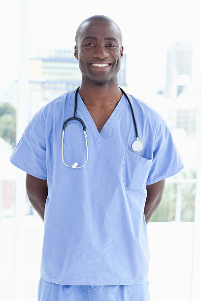 istock Young smiling intern proudly standing upright 459978293
