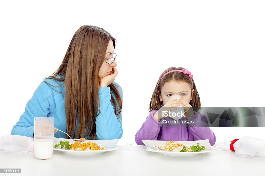 Mother is wathcing her daughter Little girl is drinking buttermilk 30-39 Years Stock Photo