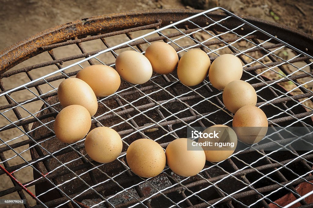 Chicken eggs Grilled over stove gridiron. Chicken eggs Grilled over stove gridiron in local market. Animal Egg Stock Photo