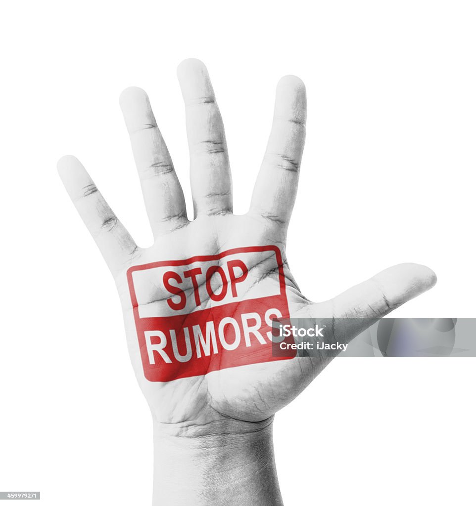 Open hand raised, Stop Rumors sign painted Open hand raised, Stop Rumors sign painted, multi purpose concept - isolated on white background Advice Stock Photo