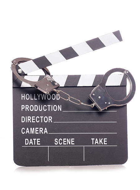 istock film clapper with handcuffs 459979835