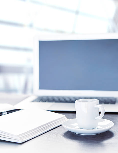 istock work desk with a cup of coffee computer laptop 459979837