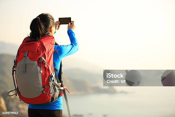 Hiking Woman Use Smart Phone Taking Photo Stock Photo - Download Image Now - Active Lifestyle, Adult, Adults Only