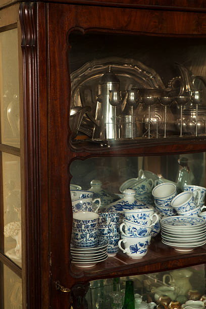 istock Antique dishware silver plated utensils and china 459981769