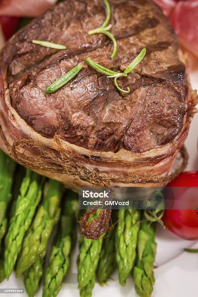 Grilled filet mignon with bacon and green asparagus Asparagus Stock Photo