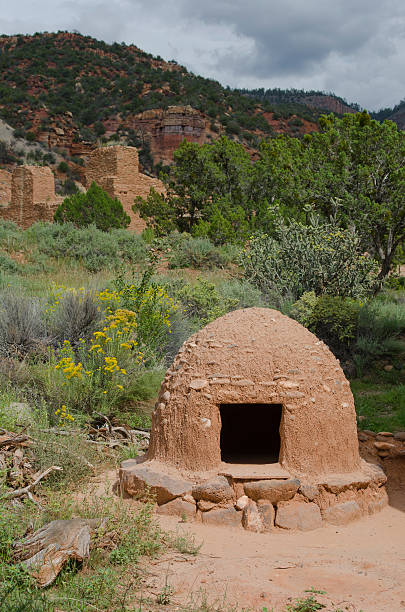 Horno at Jemez National Historic Landmark A horno or outdoor oven stands in the foreground at the Jemez National Historic Landmark, where ruins of the San JosÃ© de los Jemez church and signs of a 500 year old Indian village called Giusewa still exist.  The Spanish established the church here in San Diego Canyon in 1620, but soon after the people abandoned the site, moving to present day Jemez Pueblo. stove oven adobe outdoors stock pictures, royalty-free photos & images