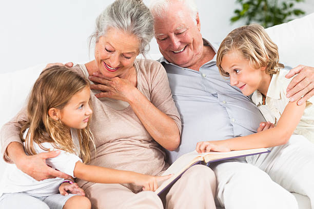 istock Children reading with grandparents 459986765