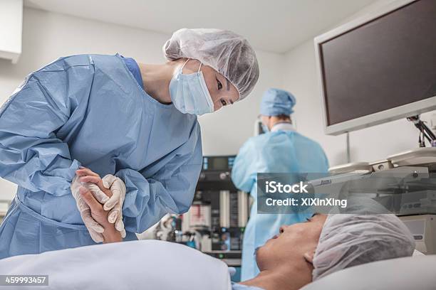 Surgeon Consulting A Patient Holding Hands Getting Ready For Surgery Stock Photo - Download Image Now