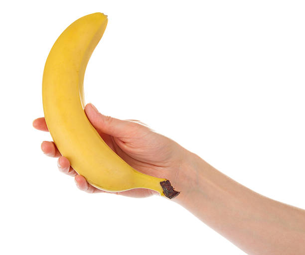 istock Female hand with banana 459993939