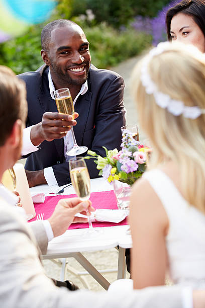 istock Friends Proposing Champagne Toast At Wedding 459994115