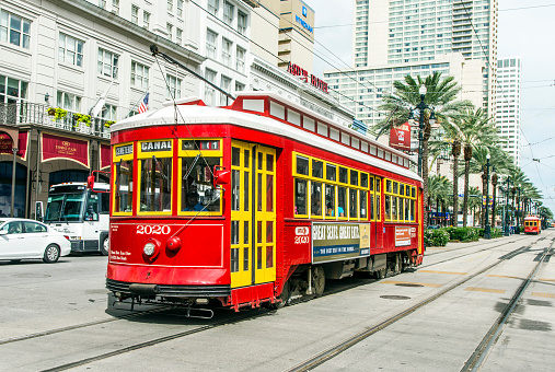 New Orleans, USA - July 16, 2013: people travel with the old Street car Canal street line St. Charles line in New Orleans, USA.  It is the oldest continually operating street car line in the world.
