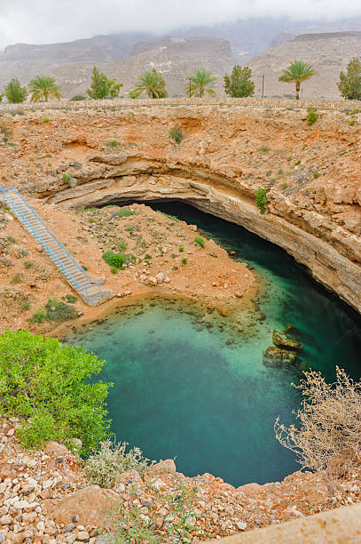 карст - natural phenomenon hawiyat najm park cliff cave стоковые фото и изображения