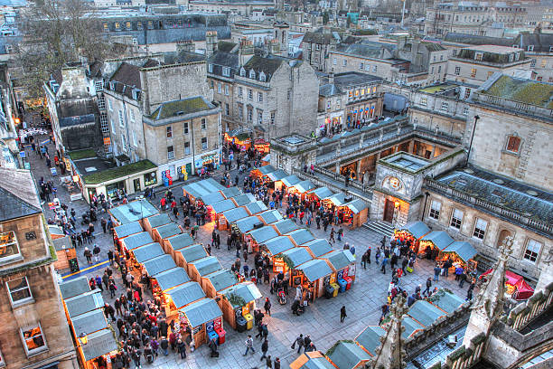 Bath Christmas Market and Roman Baths Taken from Bath Abbey, this image features the Bath Christmas Market and the Roman Baths late on a December afternoon. bath england photos stock pictures, royalty-free photos & images