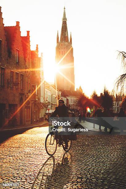 Cycling At Sunset Stock Photo - Download Image Now - Bruges, Hipster Culture, Active Lifestyle
