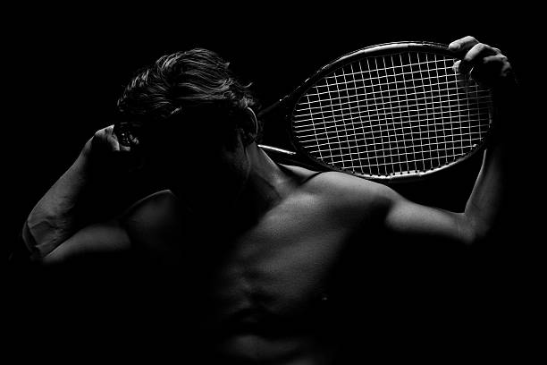 Shadowed Tennis Player stock photo