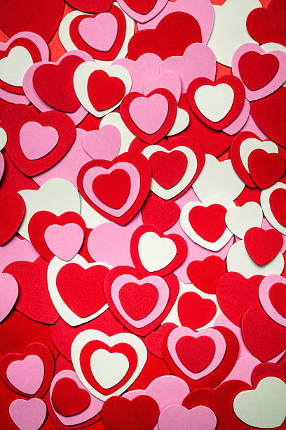 Red and pink Valentines day hearts Heart background for Valentine's day made with pink and red hearts felt heart shape small red stock pictures, royalty-free photos & images