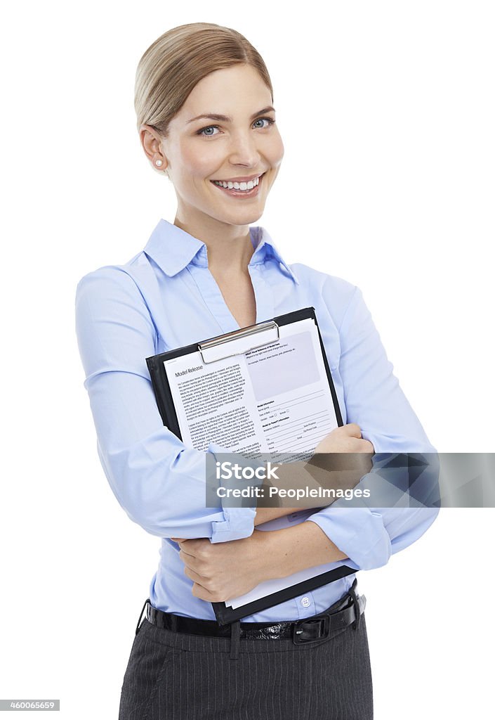 She's got the paperwork ready for you to sign Portrait of an attractive young businesswoman holding a clipboard Adult Stock Photo