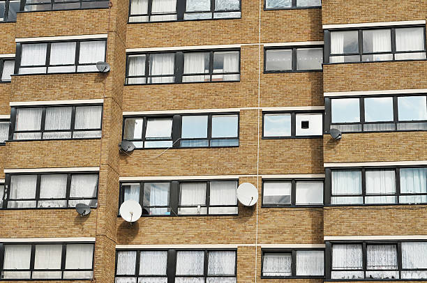 istock Block Of Flats With Satalite Dishes 460068017