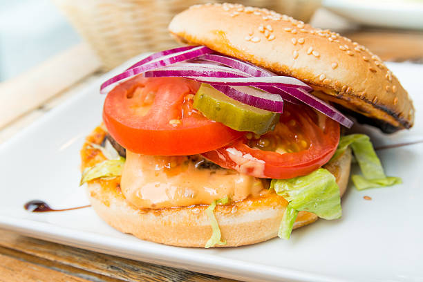 istock American cheese burger with fresh salad 460068893