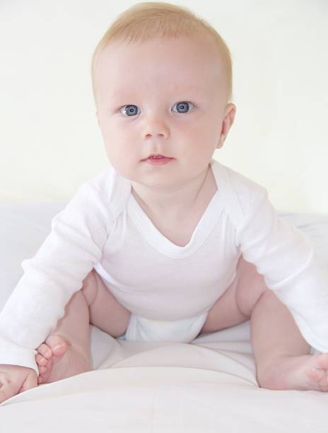 istock Cute little baby boy is sitting 460070591