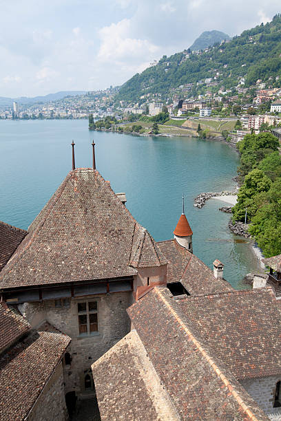 On top of Château de Chillon Veytaux, Switzerland - June 11, 2013: The Château de Chillon is an island castle located on the shore of Lake Geneva in the commune of Veytaux, at the eastern end of the lake, 3 km from Montreux, Switzerland. Address: Avenue de Chillon 21, 1820 Veytaux, Switzerland It shows the history of France and Switzerland. The staff will give you headphones in different languages so you can learn about the history of this castle. Here is the highest view from Château de Chillon. chateau de chillon photos stock pictures, royalty-free photos & images