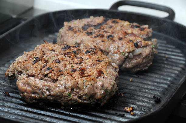 istock Hamburgers on barbeque 460080161