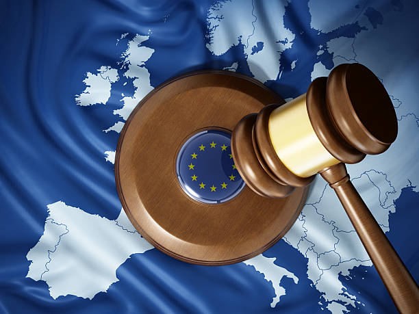 European Union justice Gavel with European Union badge standing on Europe map textured flag. european court of human rights stock pictures, royalty-free photos & images
