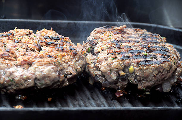 istock Hamburgers on barbeque 460082265