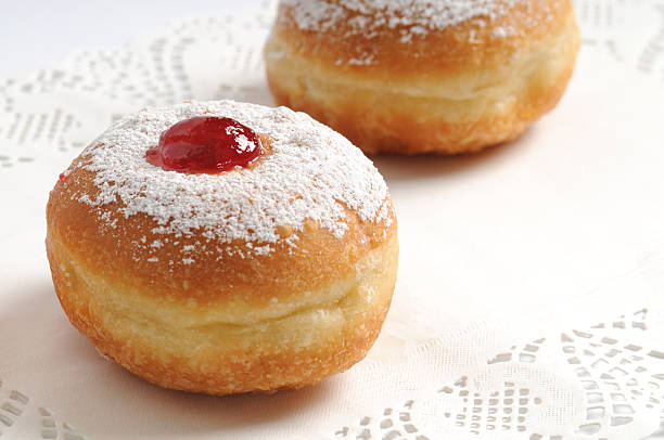 Hanukah doughnuts with red jam stock photo