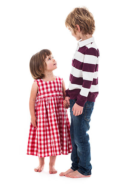 istock Young boy an toddler looking at each other on white 460090903