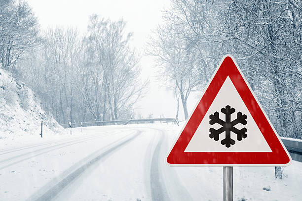 istock winter driving - snowy country road 460117755