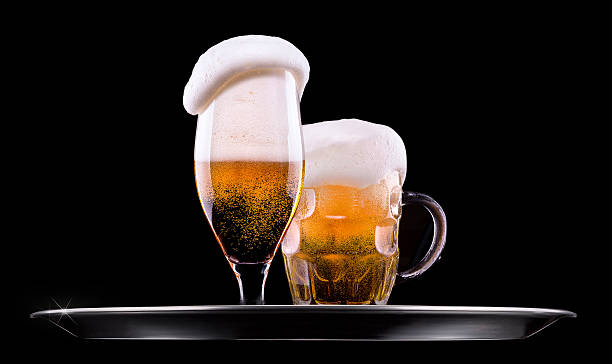 istock Beer into glass on a black 460125173