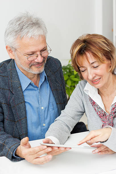istock Mature couple meeting with their financial advisor 460131705