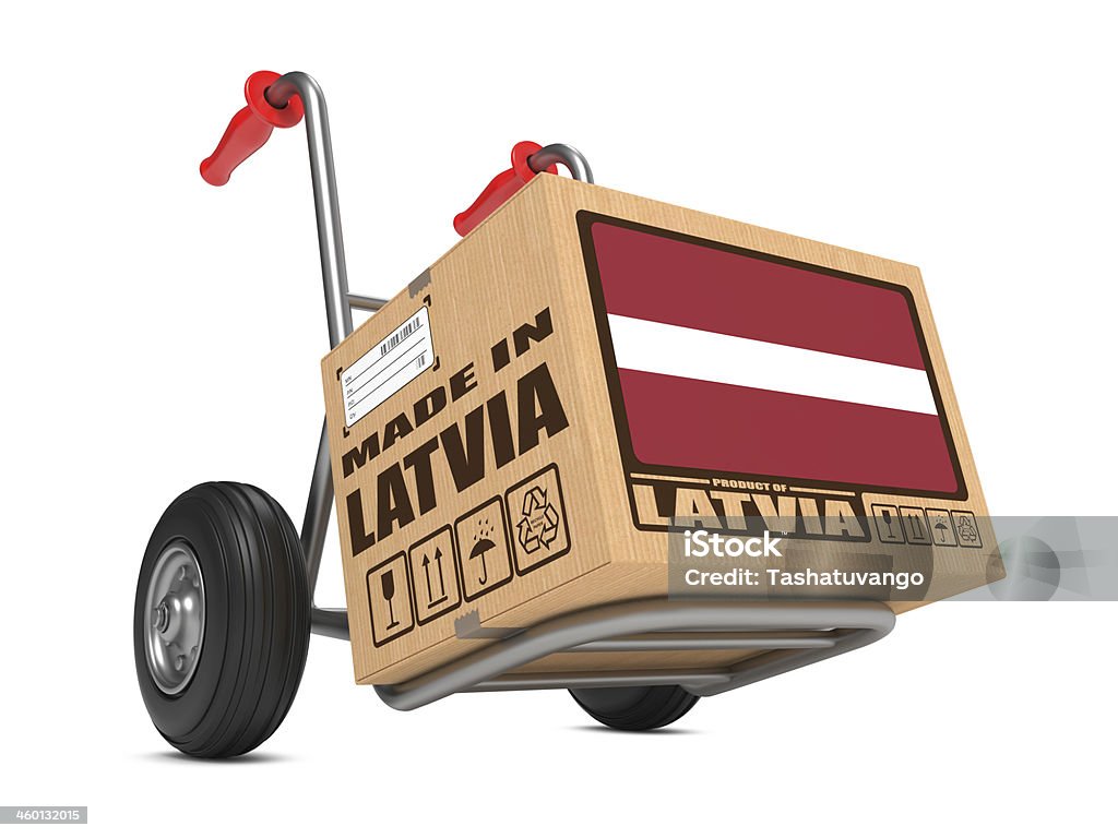 Made in Latvia - Cardboard Box on Hand Truck. Cardboard Box with Flag of Latvia and Made in Latvia Slogan on Hand Truck White Background. Free Shipping Concept. Billboard Posting Stock Photo