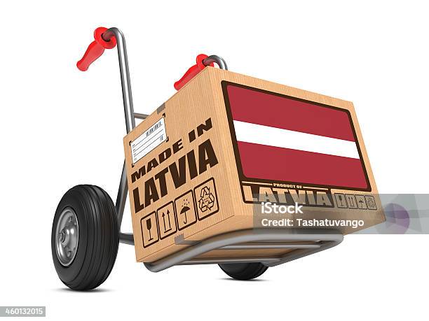 Made In Latvia Cardboard Box On Hand Truck Stock Photo - Download Image Now - Billboard Posting, Boarded Up, Boarding