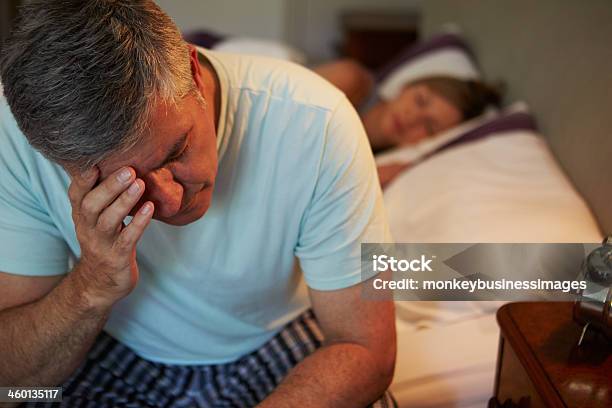 Man Awake In Bed Suffering With Insomnia Stock Photo - Download Image Now - Insomnia, Men, Mature Men