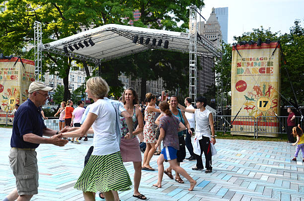 SummerDance Chicago 2013 dancers Chicago, United States - July 18, 2013: Dancers learn traditional Klezmer dances at Chicago SummerDance in Grant Park on July 28, 2013. SummerDance is celebrating its 17th anniversary. klezmer stock pictures, royalty-free photos & images