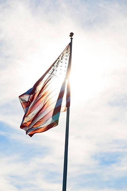 Waving American Flag in sunlight stock photo