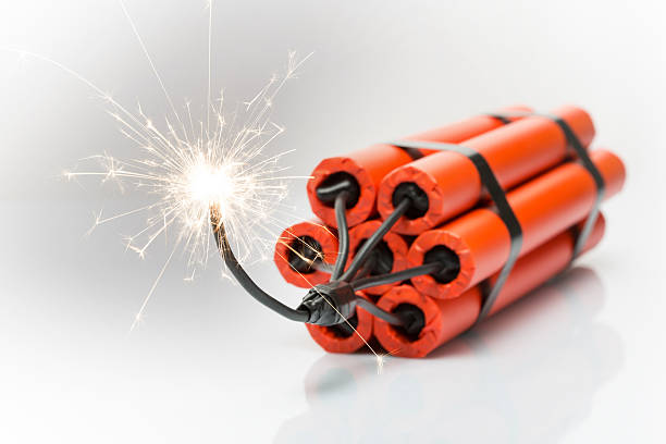 Dynamite Dynamite pack with burning wick explosive photos stock pictures, royalty-free photos & images
