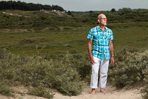 istock Retired senior man with beard and glasses outdoors. 460142949