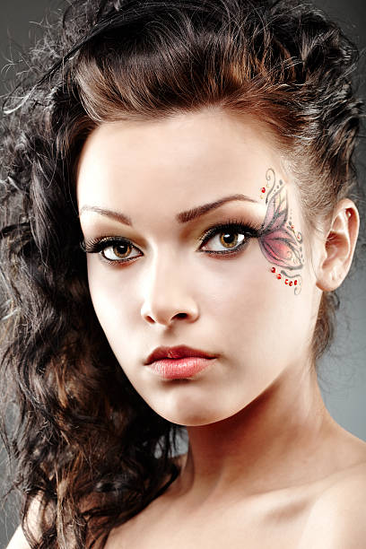 istock Beautiful woman with fantasy makeup 460147981
