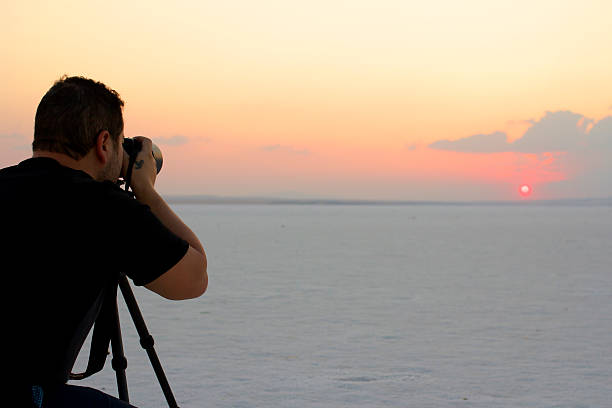 istock Photographer taking sunset shot at salt lake 460148167