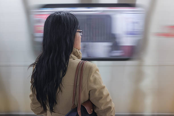 istock Woman waiting at subway station 460154221