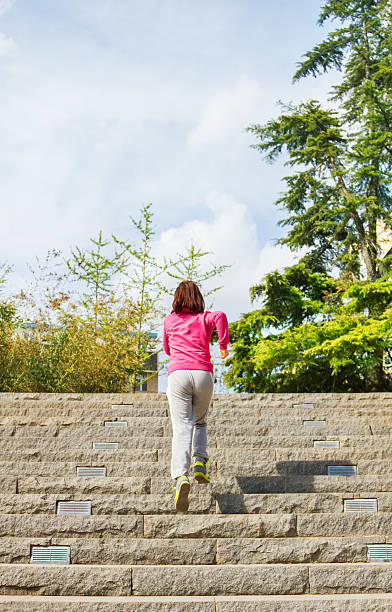 istock young female exercising in park 460156949